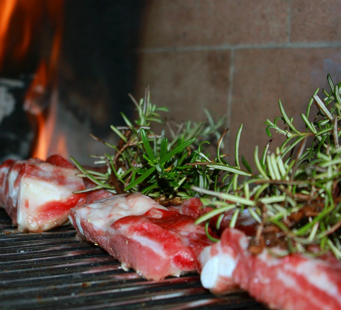 Fresh rosemary on grilled meat